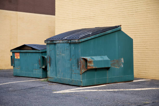 dumpster container full of cardboard for recycling purposes only.