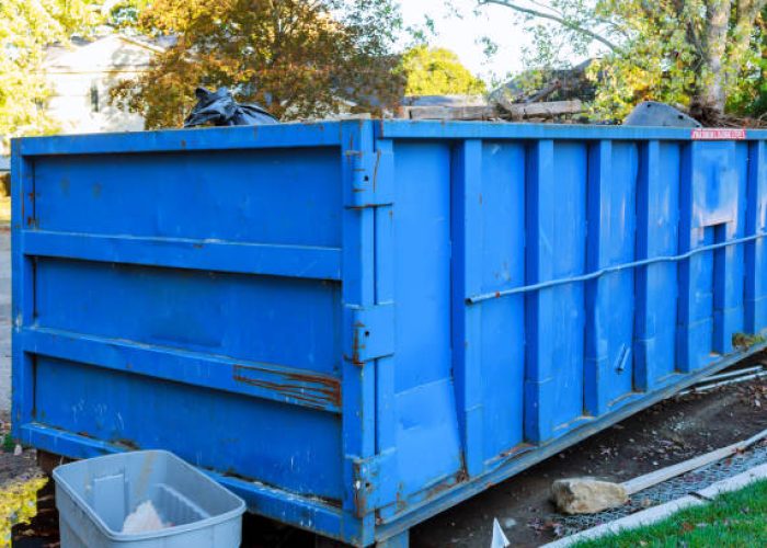 dumpsters being full with garbage container over flowing